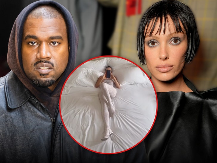 Kanye West Films Bianca Censori Laid Out in Giant Bed with Sexy Outfit