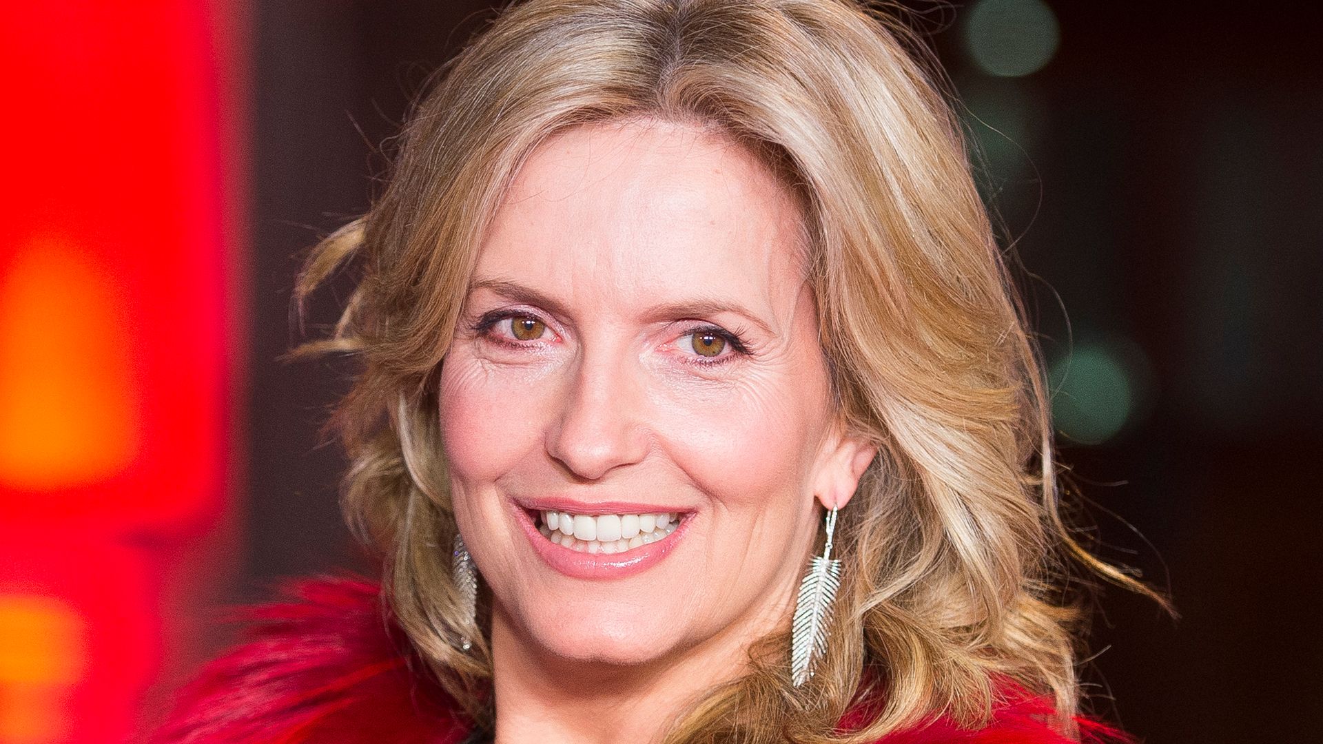 Penny Lancaster surprises in knitted flares and rocker boots