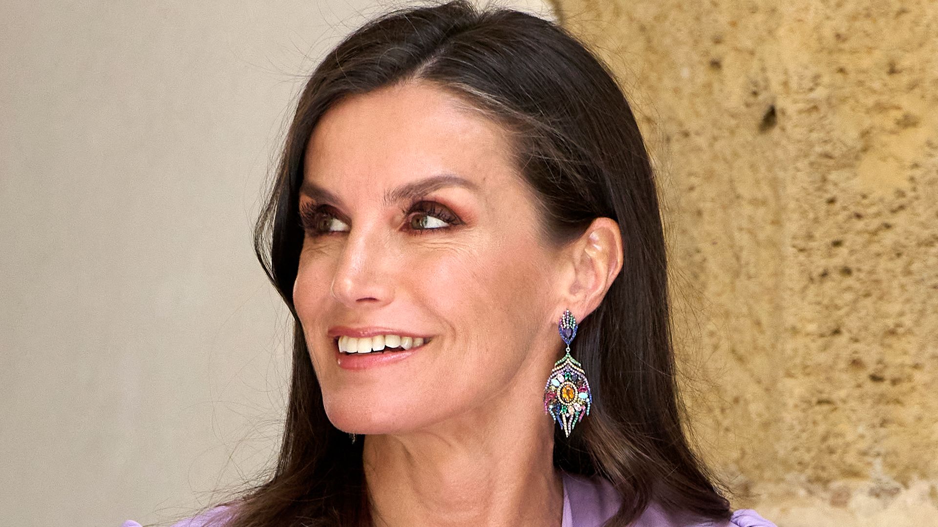 Queen Letizia looks so youthful in lace top and fitted pastel suit