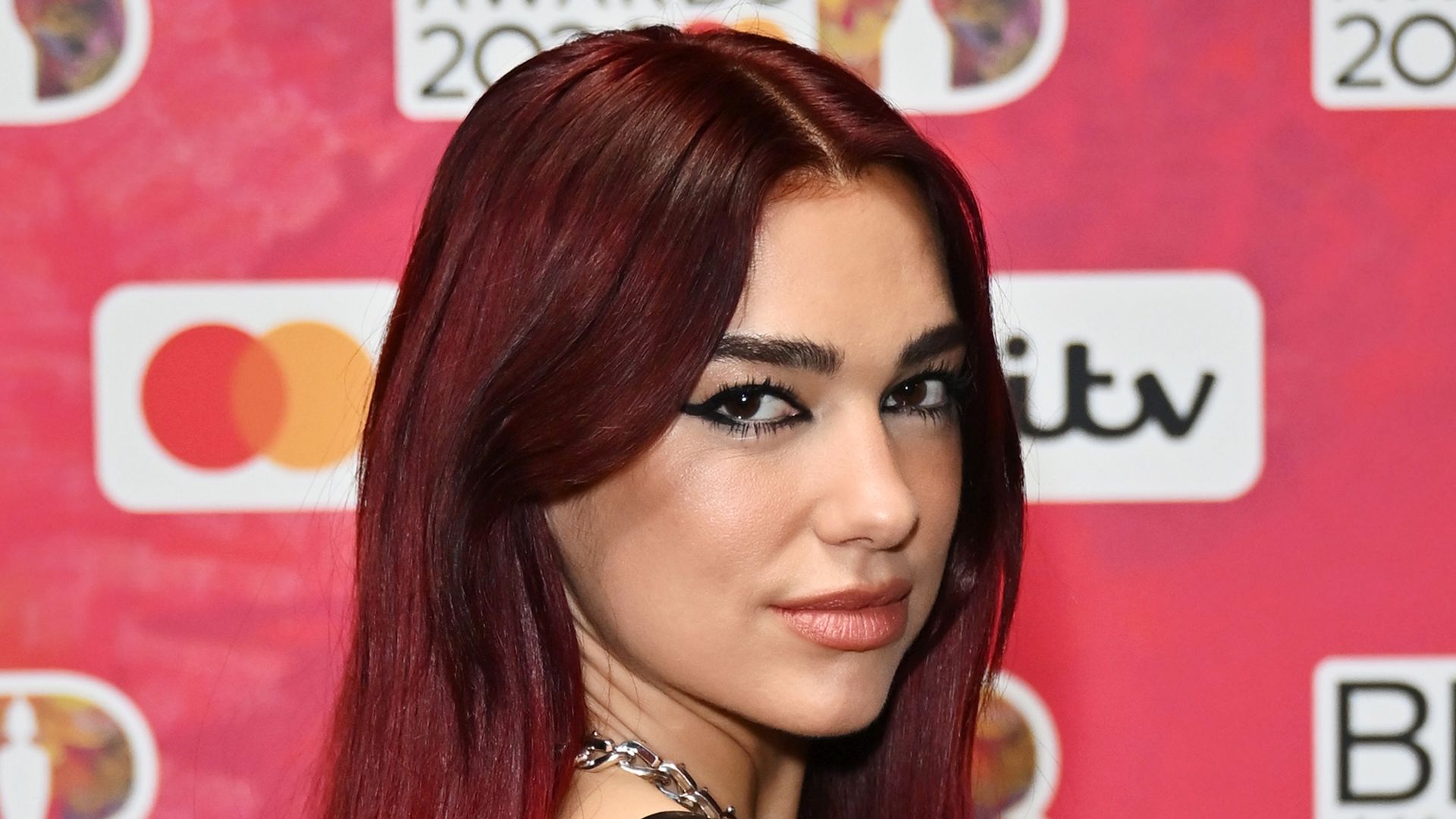 Red carpet Queen! Dua Lipa stuns in black leather gown at the BRITS