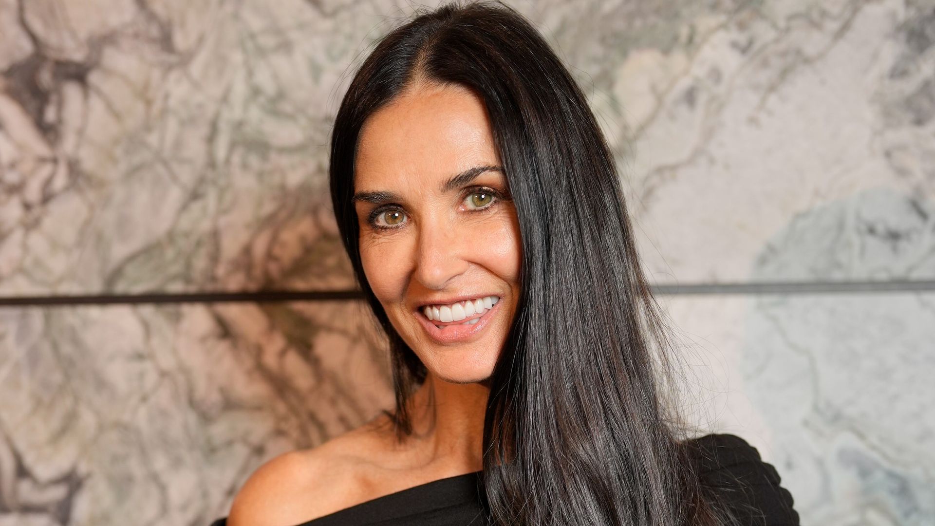 Demi Moore, 61, stuns in the slinkiest thigh-split gown with raven Rapunzel locks