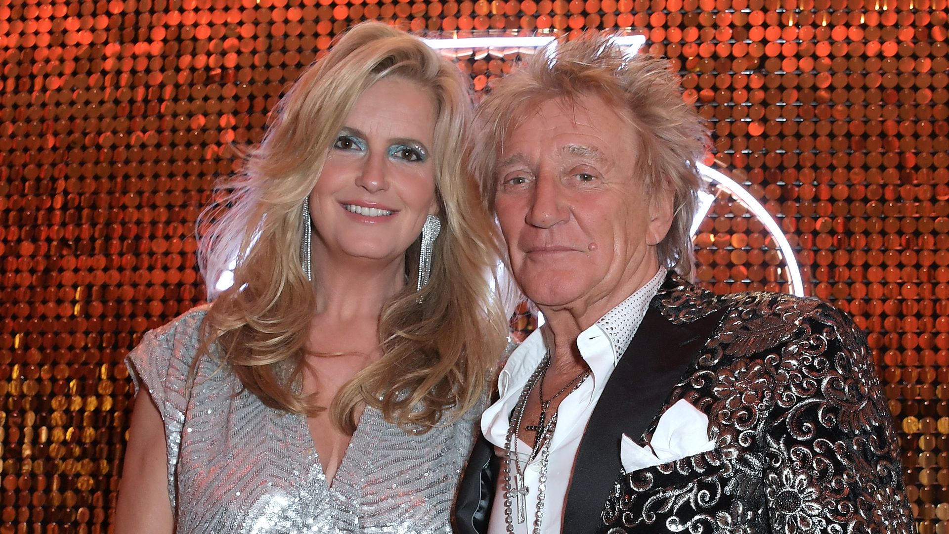 Penny Lancaster could be a movie star in floaty mini dress alongside Rod Stewart