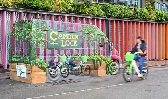 Mind-bending art installation highlights city’s e-bike parking crisis