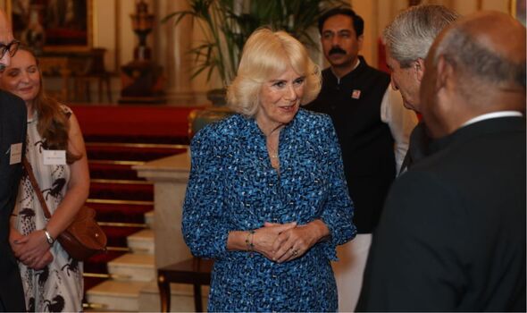 Queen Camilla recycles blue Fiona Clare dress as she hosts animal charity reception