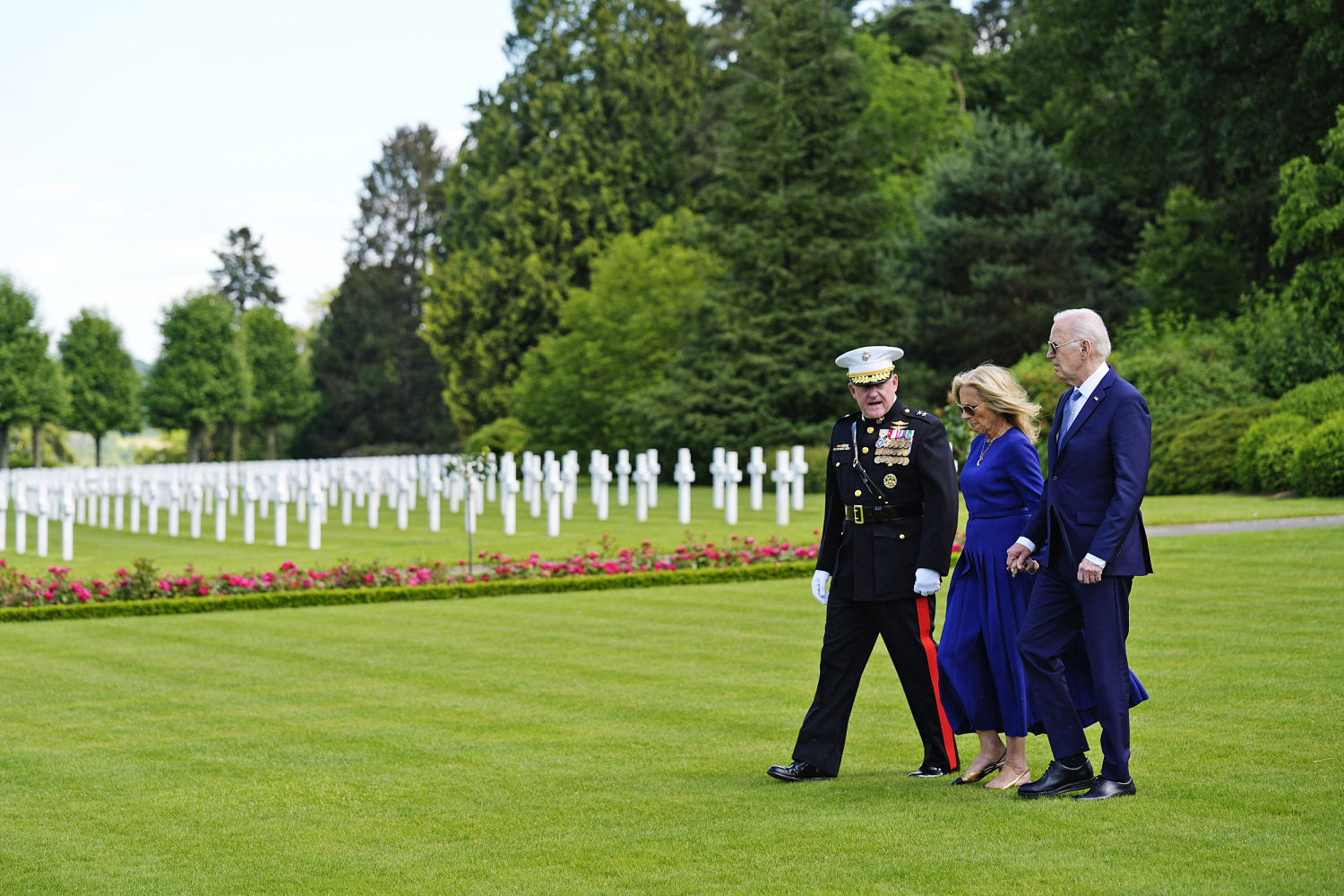 In visit to military cemetery in France, Biden attempts to draw contrast with Trump