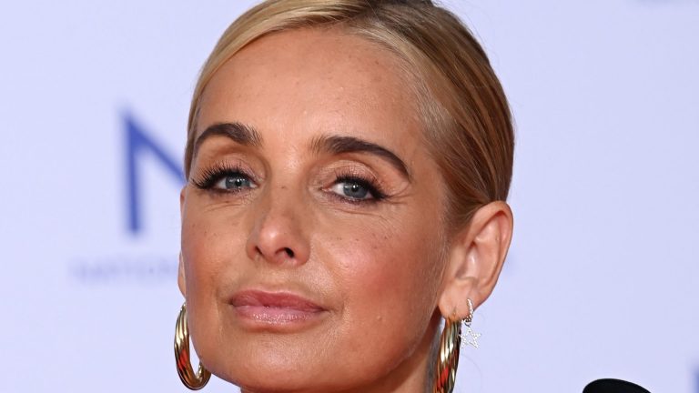 Louise Redknapp supported by boyfriend Drew Michael as she makes eye-catching performance in knee-high leather boots