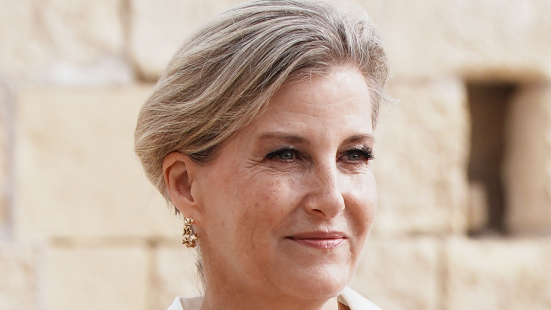 Duchess Sophie is sassy in hoop earrings and bodycon dress