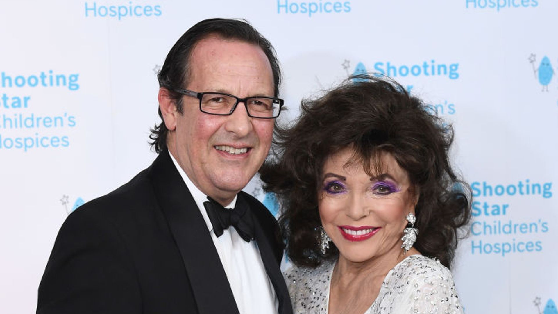 Joan Collins, 91, turns heads in stunning bridal-white dress for celebrations with husband Percy