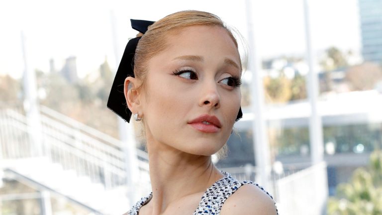 Ariana Grande stuns in tweed mini dress with sheer stockings