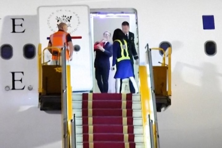 Macron’s wife shoves him on plane in moment caught on video