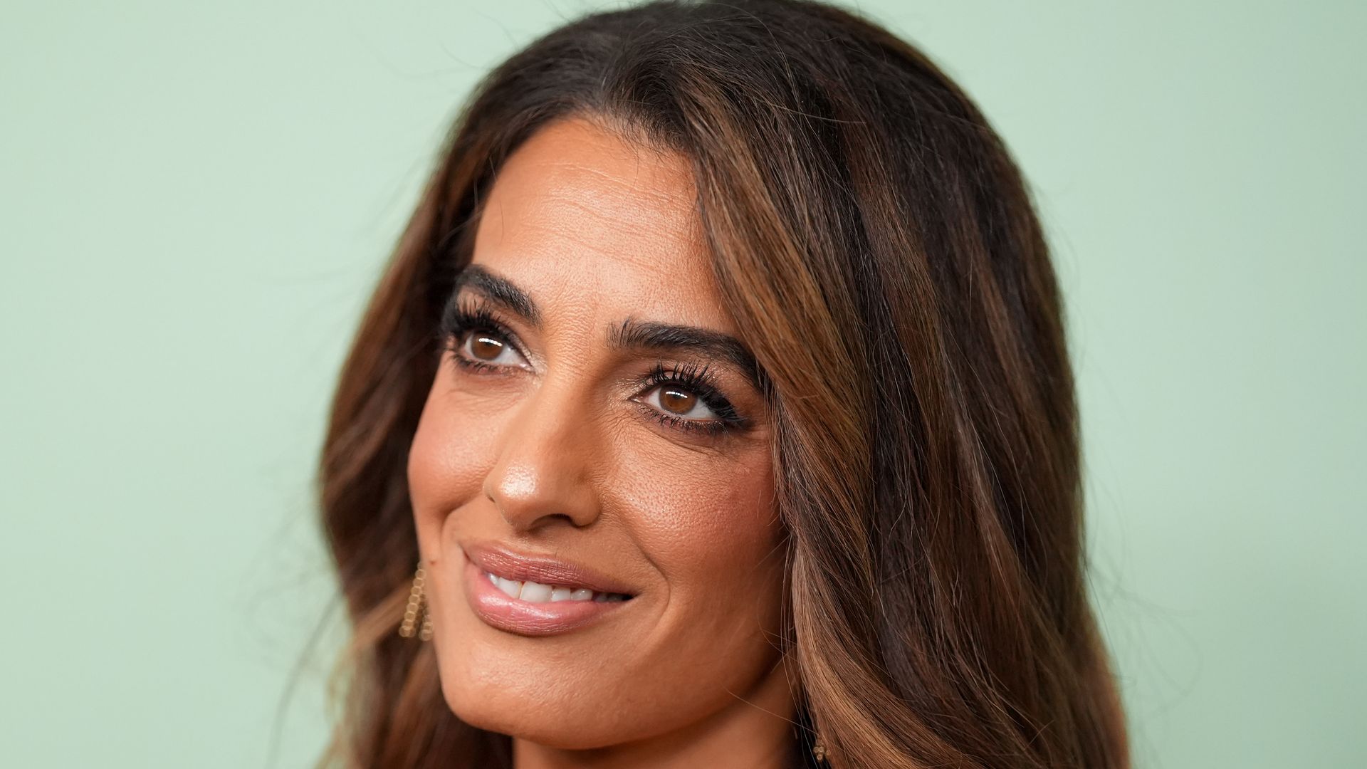 Amal Clooney emerges in Paris in leg-lengthening pants – with glossy latte hair