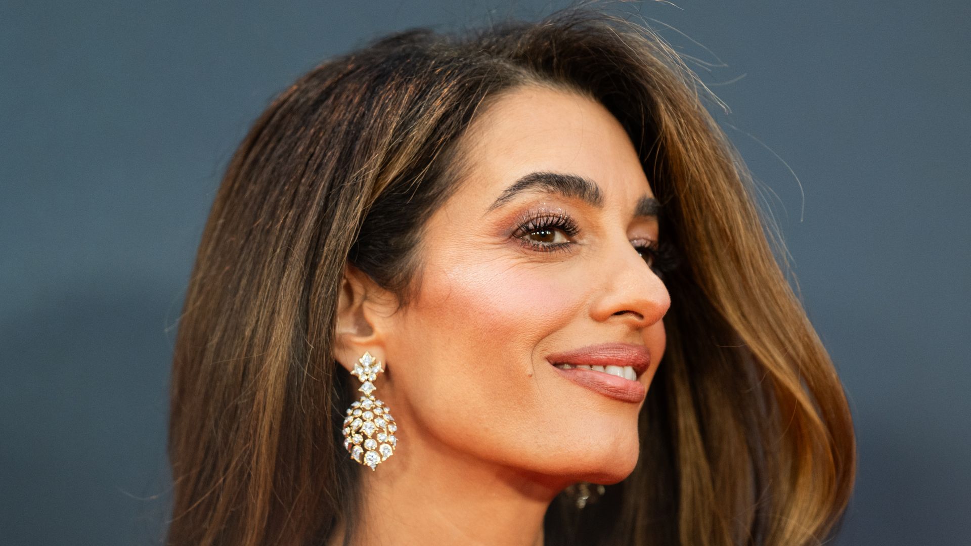 Amal Clooney rewears red hot jumpsuit from 6 years ago – and looks better than ever