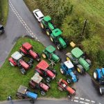 Furious farmers amass tractors in protest over 114-mile pylons through UK countryside