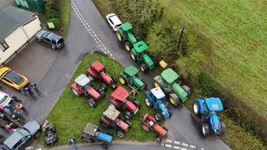 Furious farmers amass tractors in protest over 114-mile pylons through UK countryside