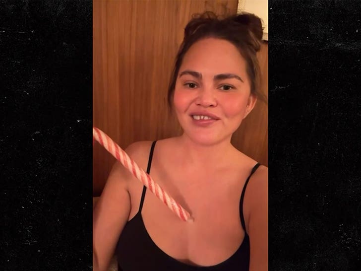 Chrissy Teigen Knocks Out Front Tooth With Candy Cane, in Hilarious Video