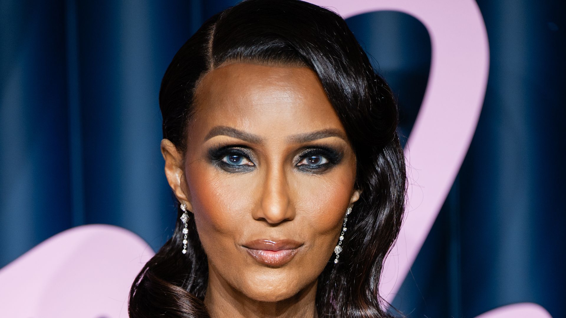 Iman, 70, looks ageless as she pulls off ‘tricky’ corset dress