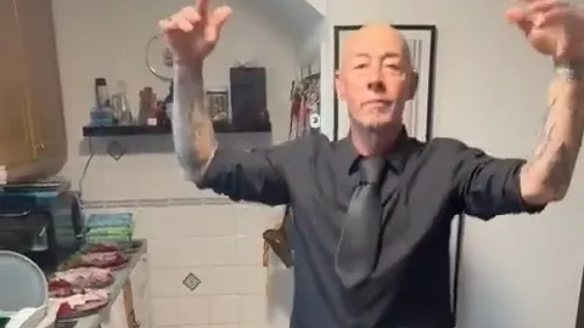 Boyband star, 53, looks unrecognisable as he dances in his kitchen 32 years after pop fame and getting normal job
