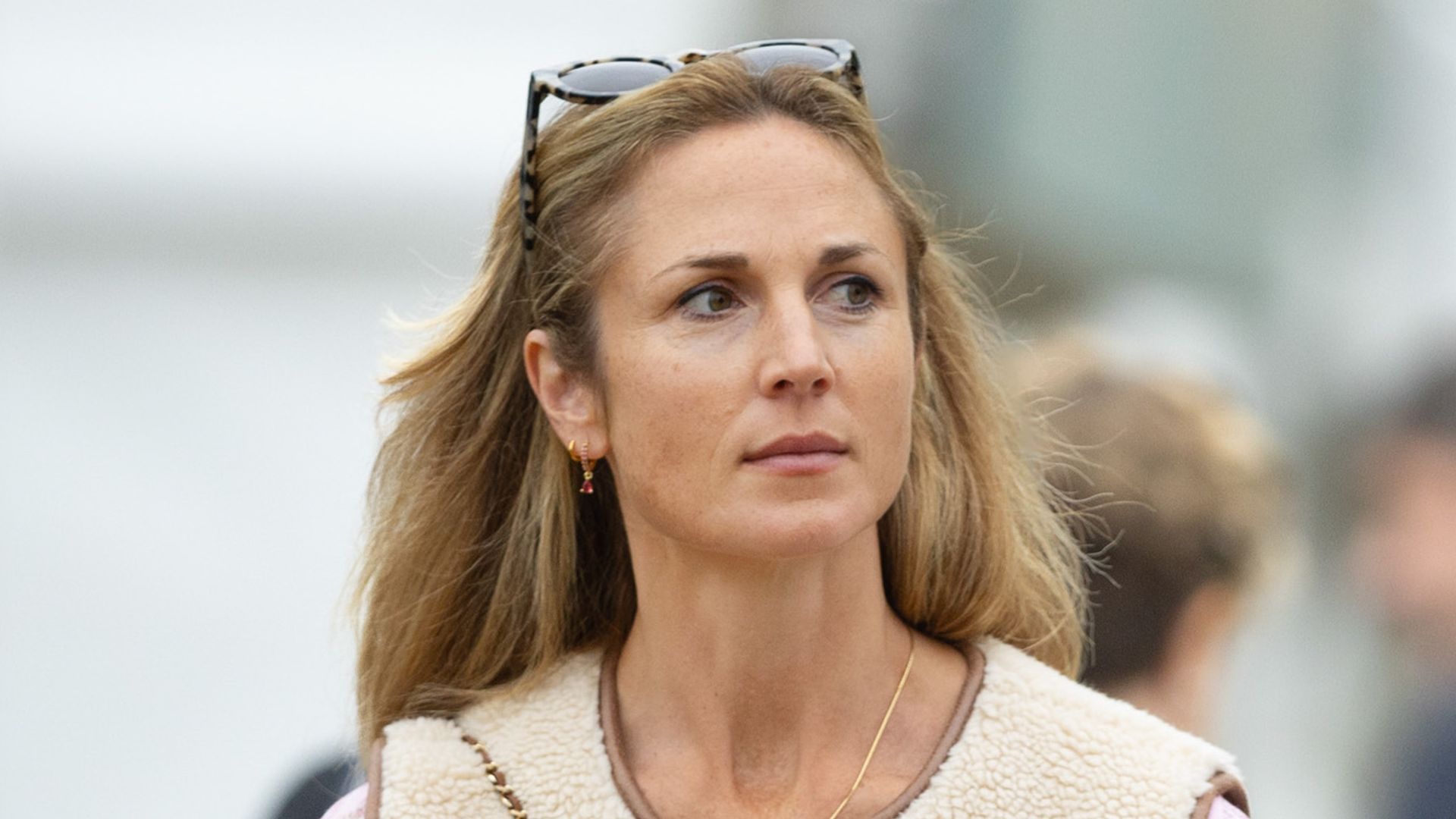 Harriet Sperling nails winter race-day dress in pleated mini-skirt and it-girl bag