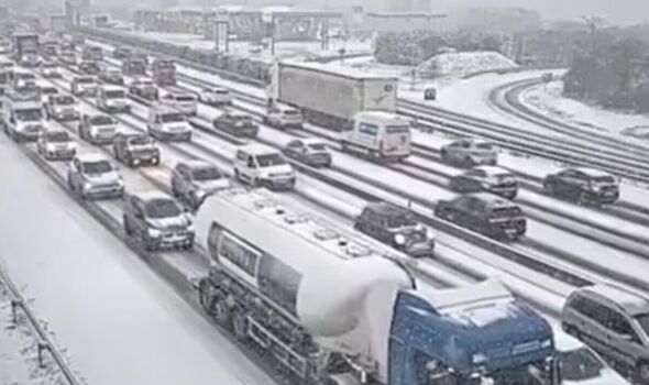 Travel chaos as hundreds of flights to Europe cancelled and snow causes 1000km traffic jam