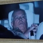 Photo of Andrew after arrest hung in the Louvre art gallery