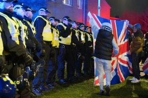 Anti-migrant protest erupts outside block of flats after two people stabbed