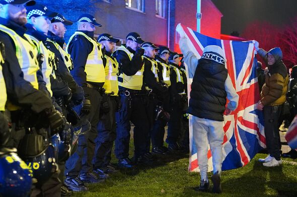Anti-migrant protest erupts outside block of flats after two people stabbed