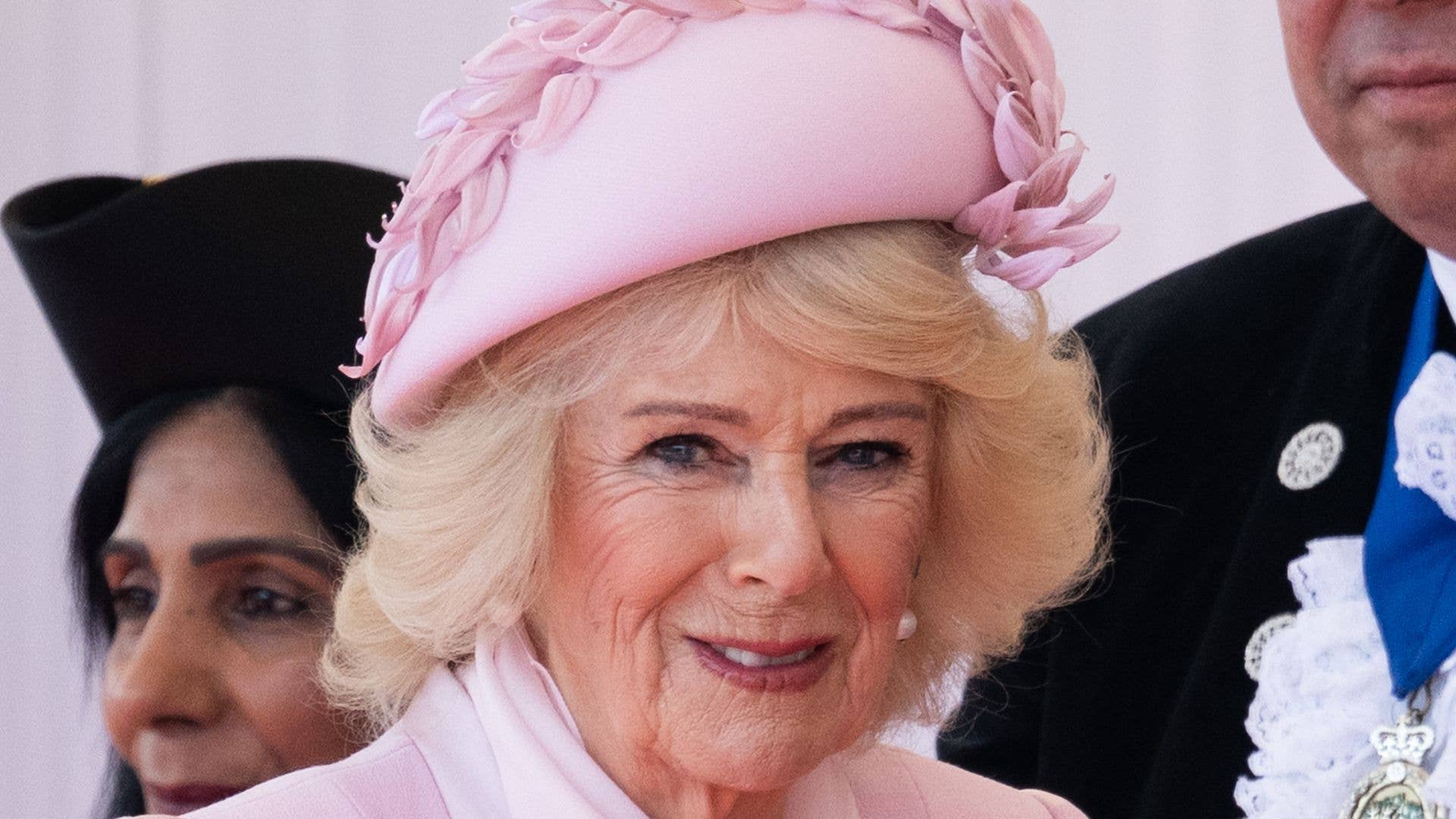 Queen Camilla channels Barbie as she’s seen carrying the bag Princess Diana made famous