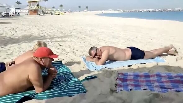 Russian family’s insane reaction on Dubai beach as Iranian bombs drop around them