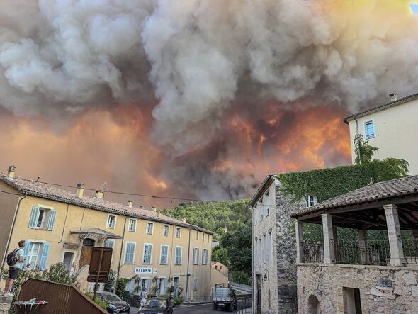 Brits running for their lives as holiday hotspot sent evacuation warning over huge fires