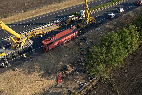 At least 12 die as tourist bus flips near Budapest ‘leaving people trapped’