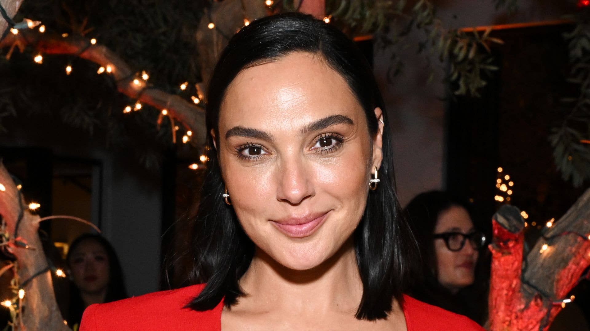 Gal Gadot turns up the heat in dangerously plunging red dress at star-studded party