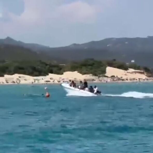 Horror as migrant boat crashes into and injures swimmer
