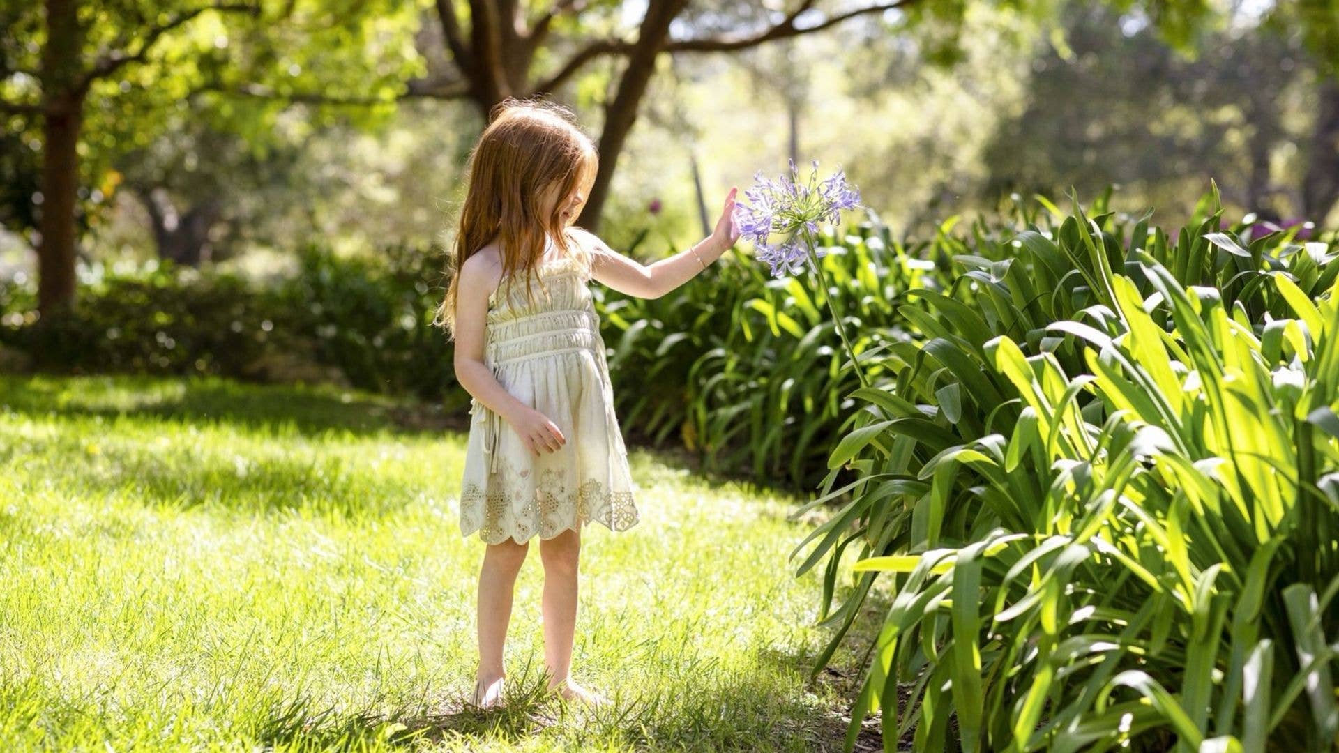 Princess Lilibet steals the show in mini cowboy boots – and the longest Disney hair