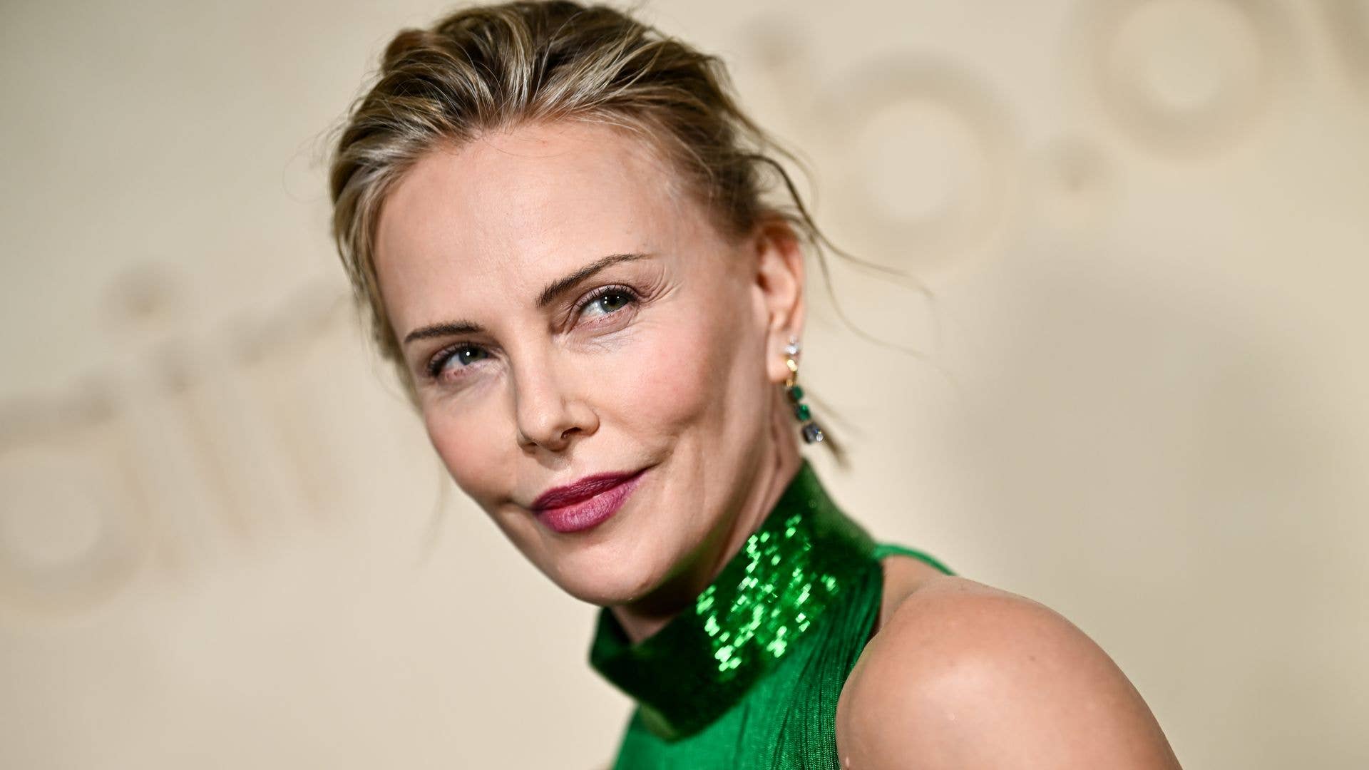 ‘Goddess’ Charlize Theron shows off longest legs in striking fringe dress